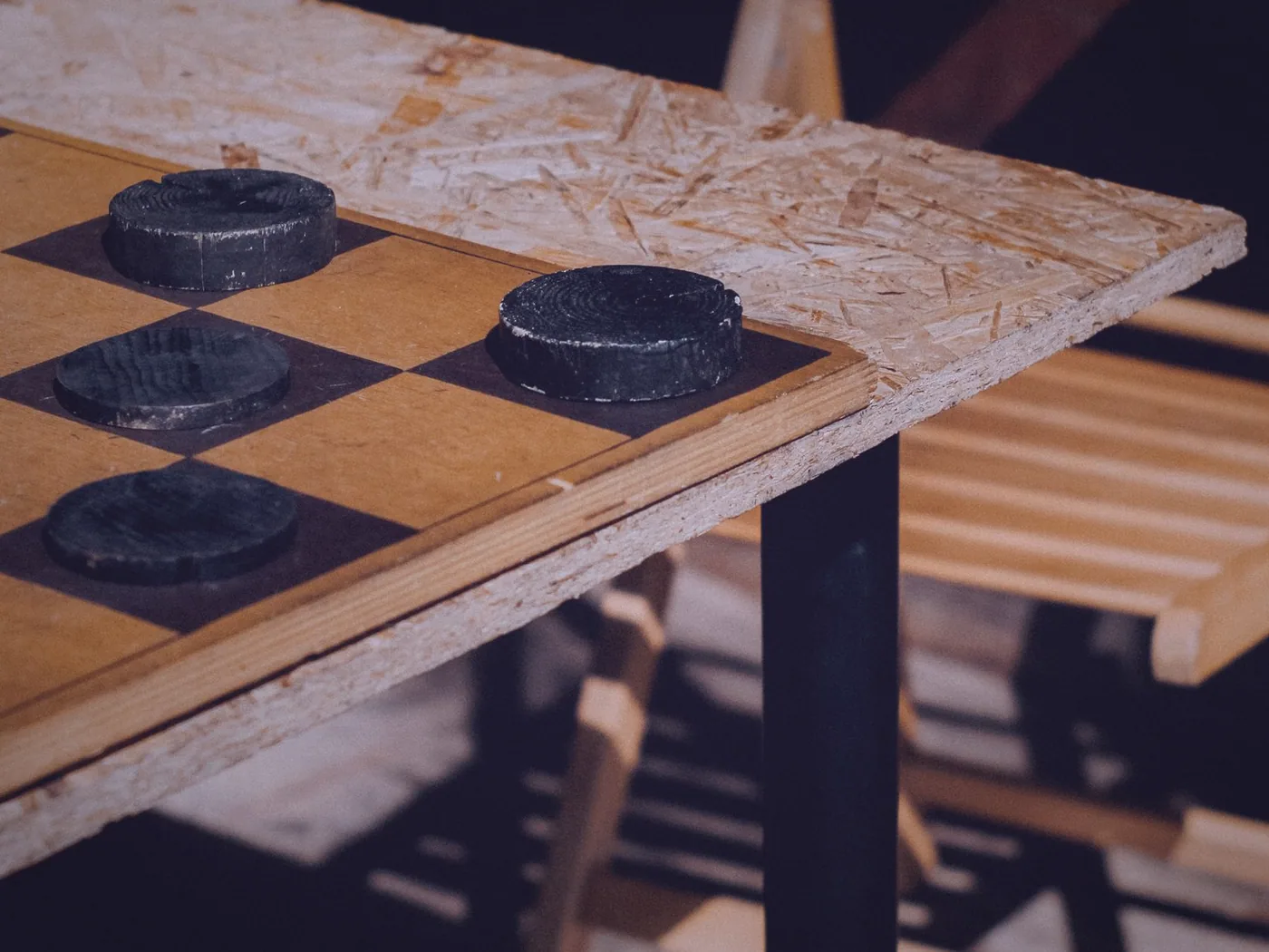 A game master's screen, character sheets and miniatures on a wooden table